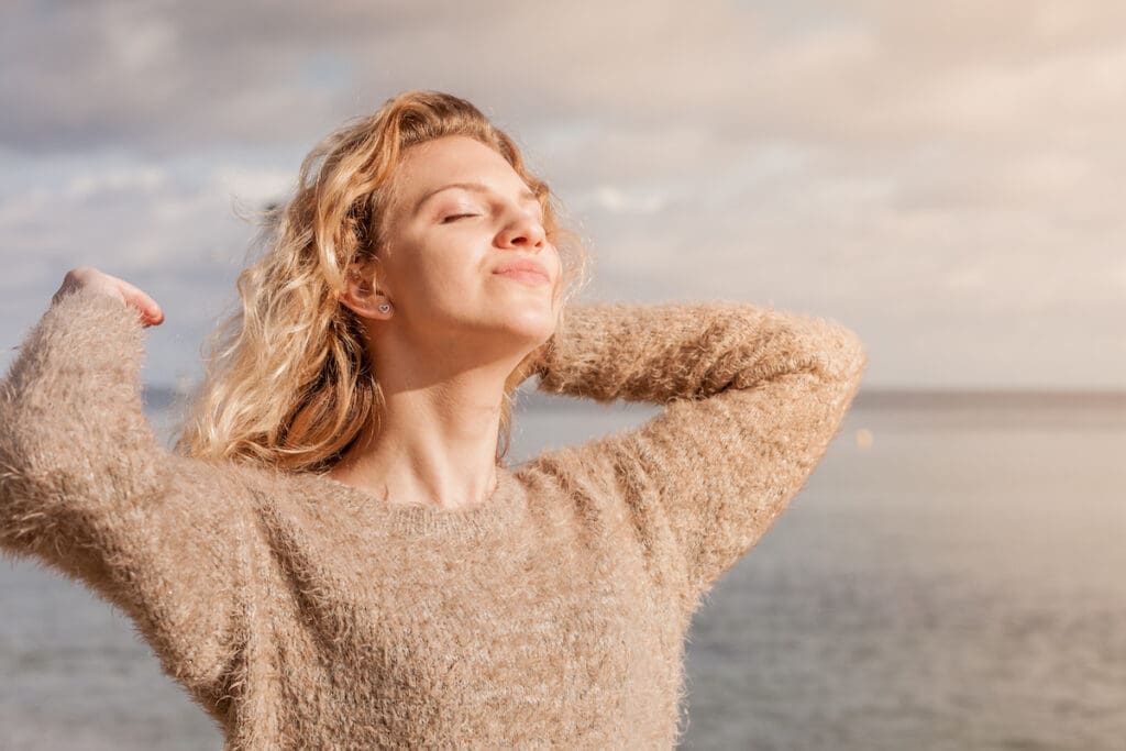 A woman getting sunlight exposure for healthy vitamin D levels